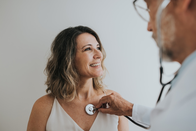 Woman undergoing heart health exam