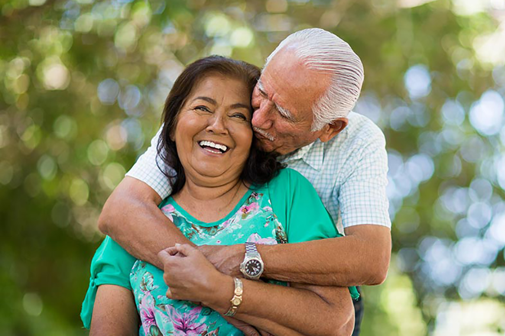 Man kissing wife