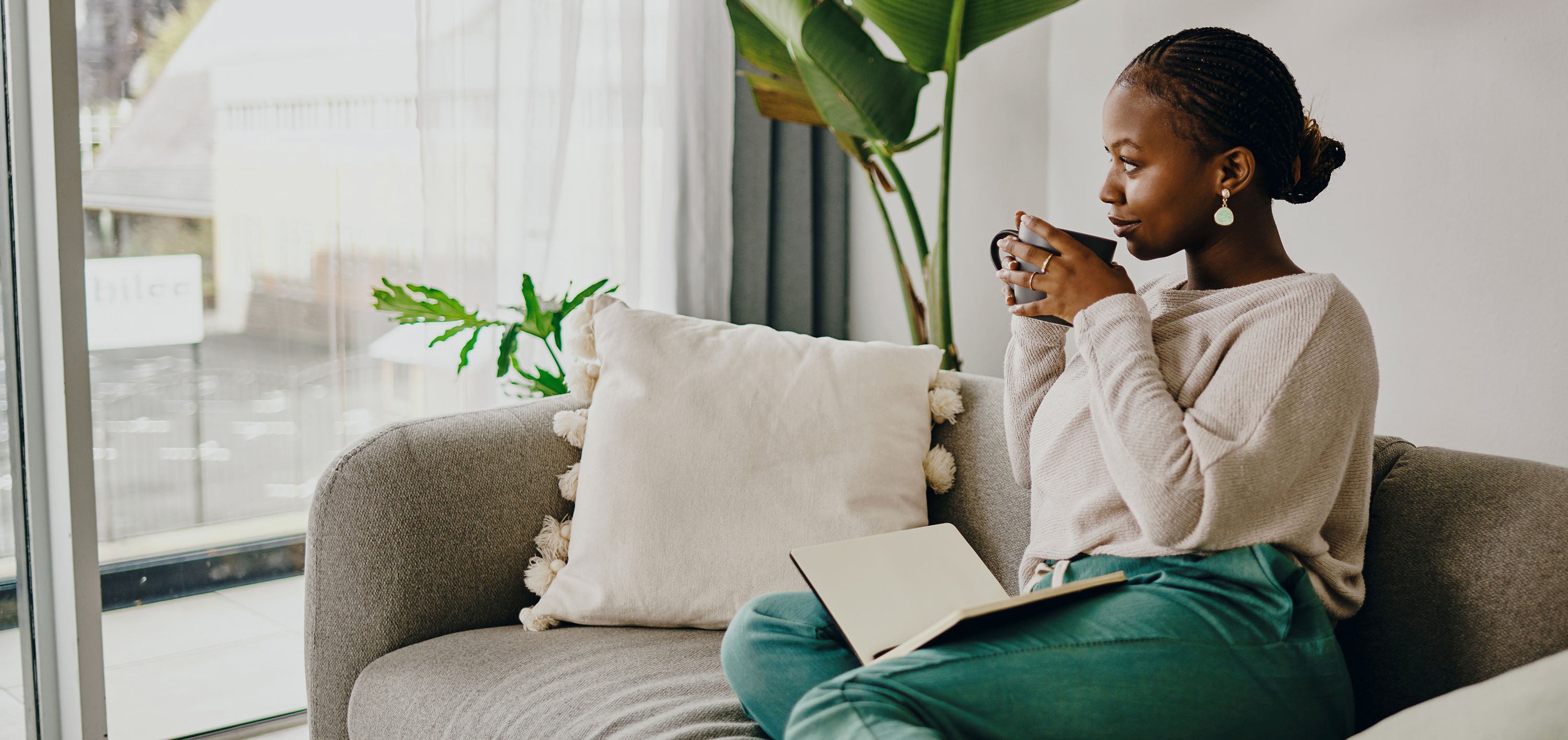 A woman relaxing and focusing on her sofa