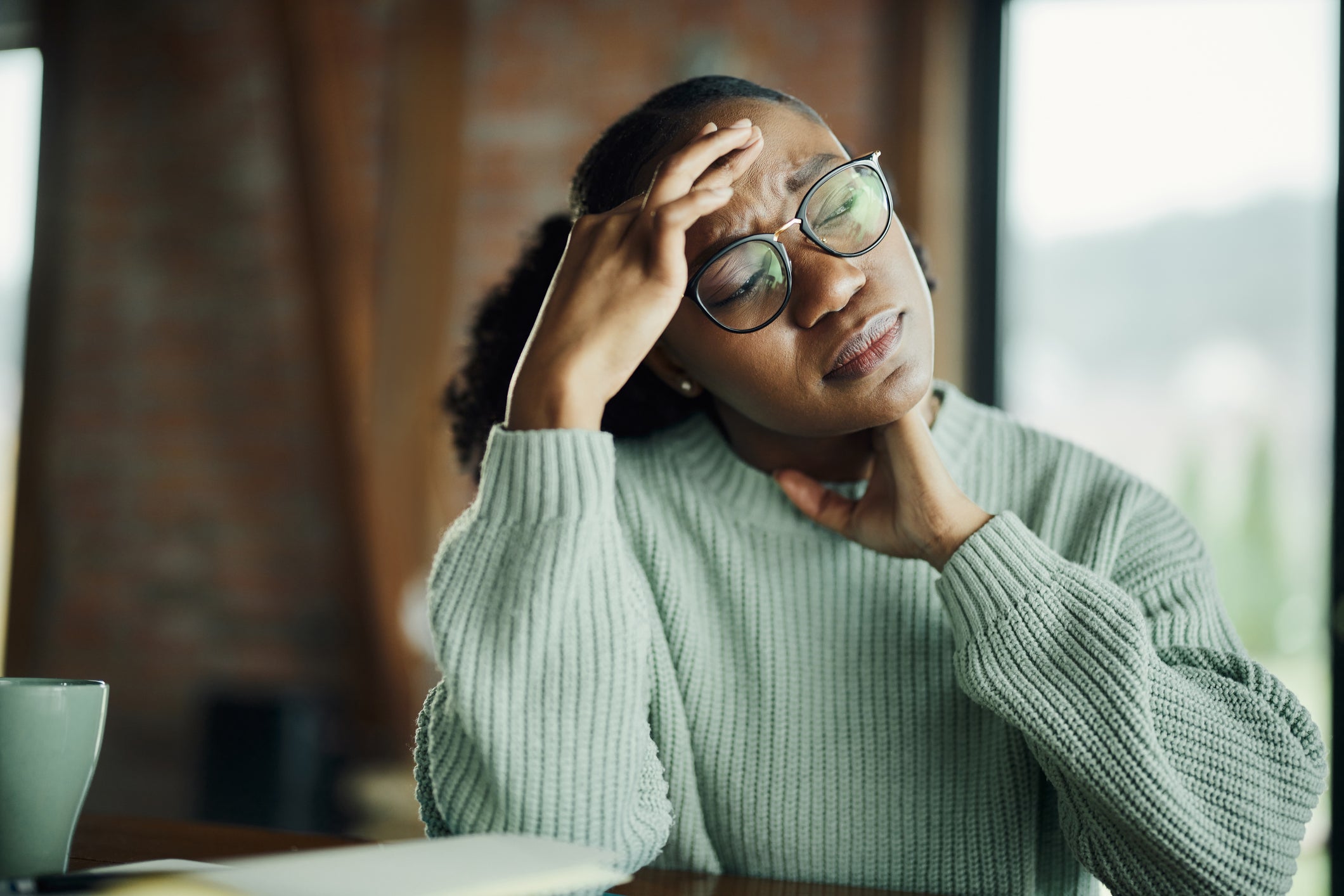Young woman experiencing migraine discomfort