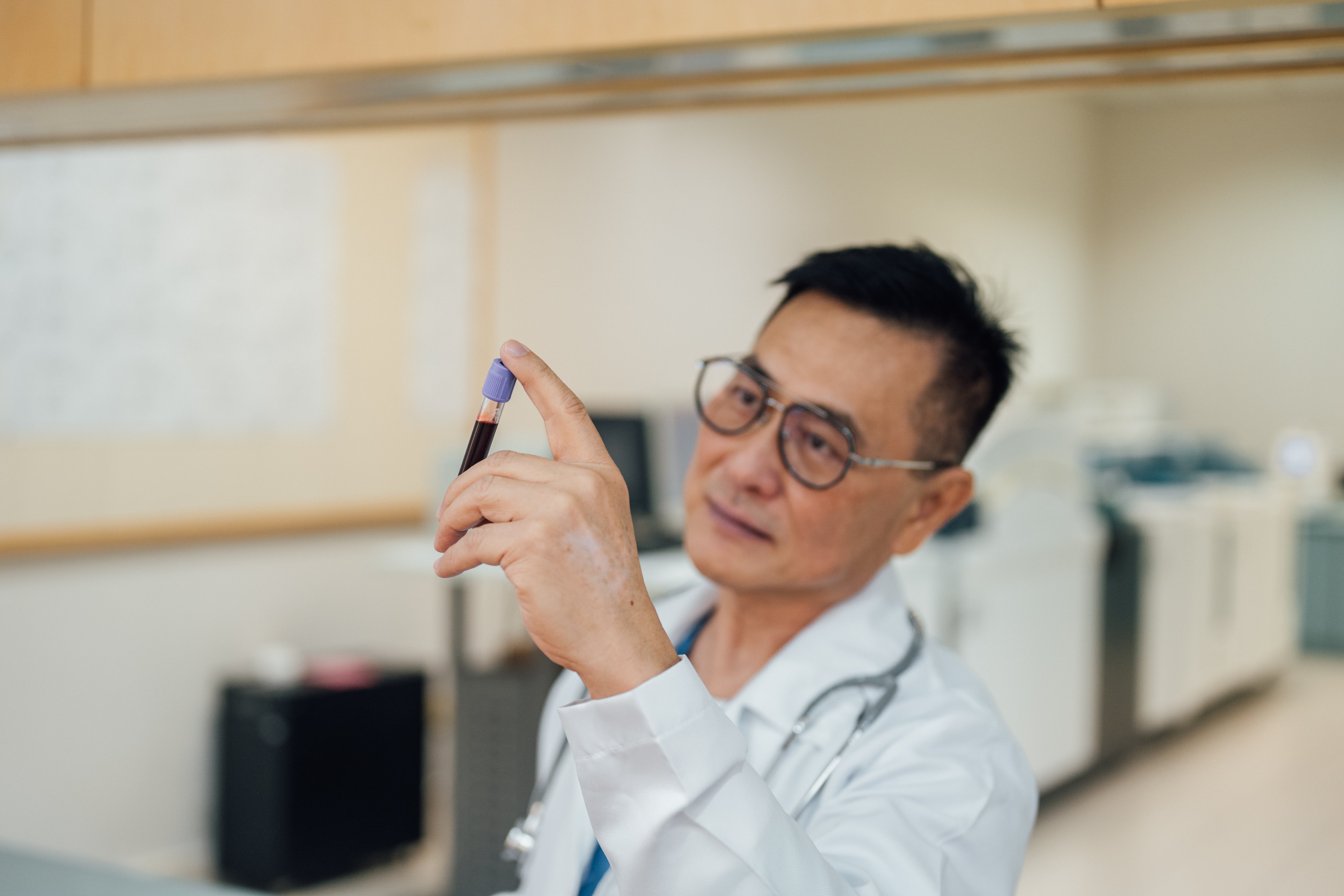 A physician analyzes a blood sample