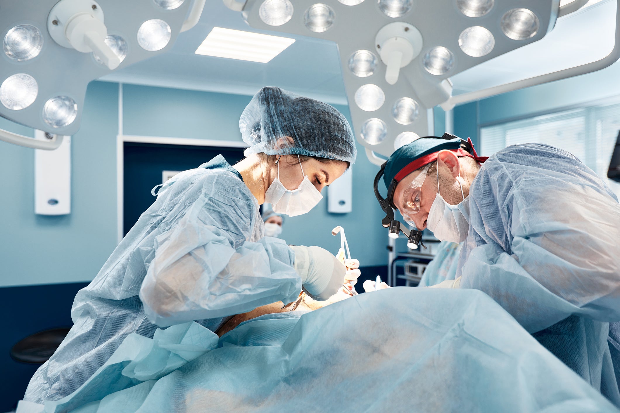 Surgical Oncologists working in operating room