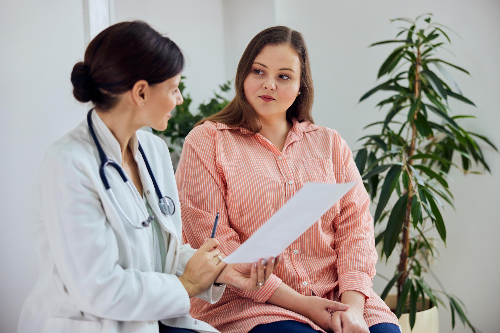 Doctor speaking to patient regarding her weight loss options