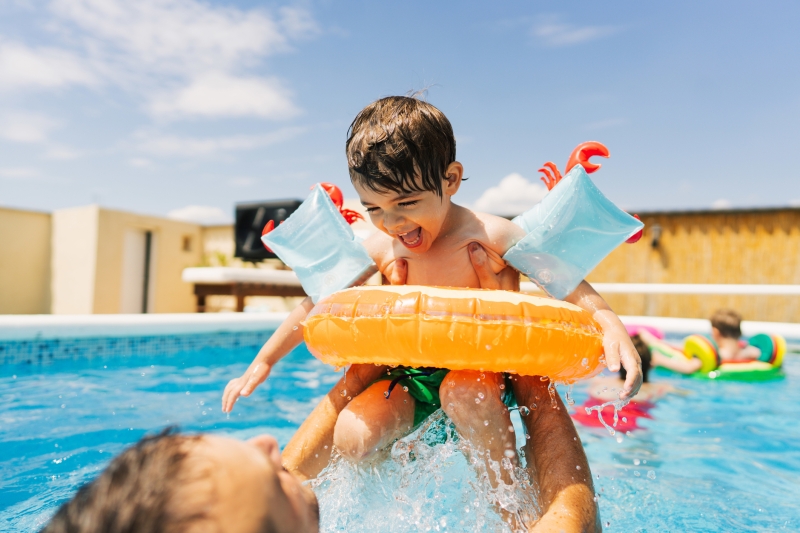 A child being taught how to safely swim
