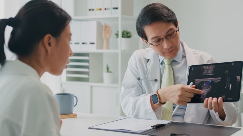Doctors conferring with each other