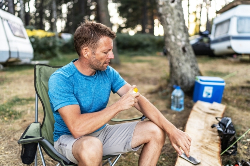 Man concerned with a bug bite on his arm