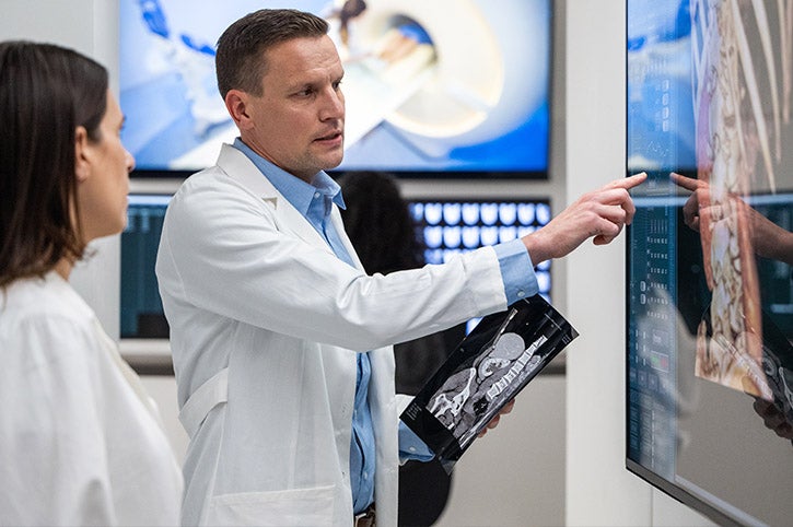 Doctors examining x-ray results