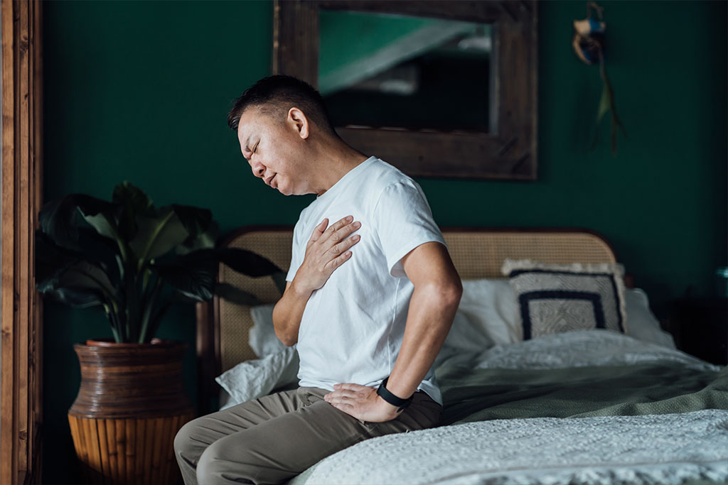 Man feeling sore chest